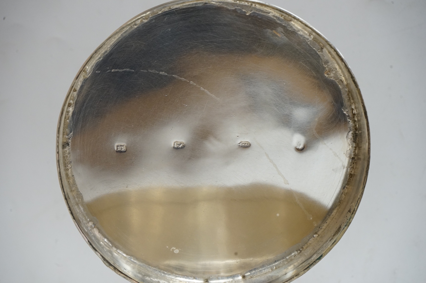 An early 19th century Dutch white metal circular biscuit box, with hinged cover and reeded bands, maker IT, retailed by Diemont, height 78mm, together with a pair of Victorian silver fiddle pattern table spoons by Willia